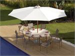 Barlow Tyre Stainless Dining Set with 8 Chairs and a round table and a large teak market umbrella.