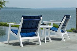 two chairs by the water, white and navy
