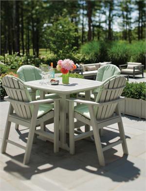 Four Adirondack Bar Chairs around a Table Outside