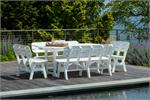 white table with benches on a pool deck