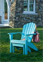 Seaside Casual's Coastline Adirondack Chair shown in Teal with a matching footstool that simply tucks under the chair when you are not using it.