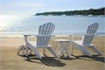Seaside Casual's Coastline Adirondack Chair shown in White with matching footstool and folding side table. (both optional)