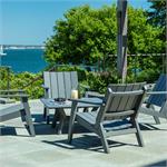 Four Chairs around a table with water in background